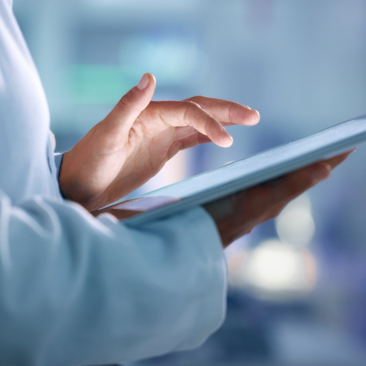 doctor, researcher or scientist browsing the internet on a tablet for information while working at a lab, science facility or hospital. expert, medical professional or surgeon searching the internet